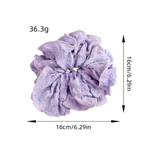 Elegant purple gradient fabric scrunchie with pleated texture and soft aesthetic design