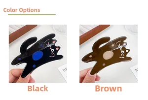 Close-up of cute cat-shaped hair claws in black and brown acetate with glossy finish