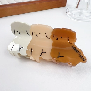 Three teddy dog acetate hair claw clip in cream, beige, and caramel brown colors