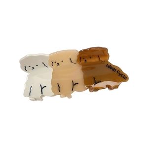 Three acetate teddy dog hair claws in white, beige, and brown with Ideal Cycle text