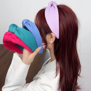 Wide knotted fabric headband in vibrant purple, rose, green and blue for women