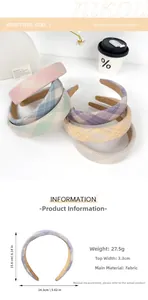 Detail view of colorful plaid fabric headbands showing texture and dimensions