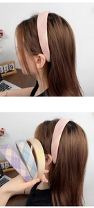 Close-up of wide plaid headbands in macaron colors showing fabric texture and design