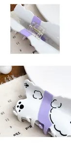 Detail view of purple acetate dog hair claw clip with cute paw prints and spring