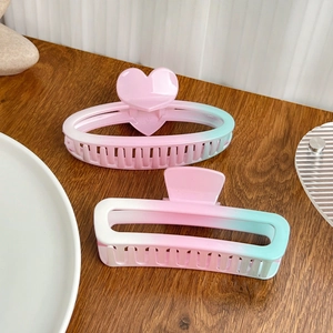 Pink and mint green gradient hair claws set in heart and rectangular glossy shapes