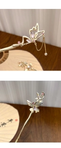 Close-up of golden butterfly hairpins with pink crystals and elegant tassel detailing