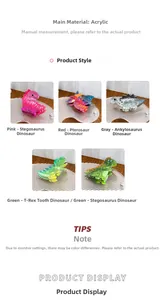 Detail of five colorful acrylic dinosaur hair claws with marble texture and cute cartoon designs