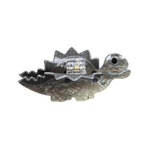 Cute acrylic dinosaur hair claw clip with stegosaurus design and glossy grey finish
