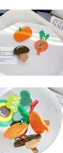 Detail of creative acetate fruit and vegetable hair clips with metal duckbill clips