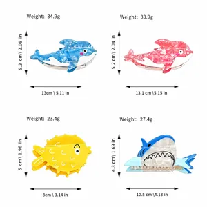 Size guide for various ocean animal hair clips featuring dolphins and sharks in acetate