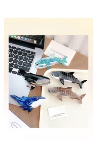 Detailed view of marble-textured ocean-themed whale hair claws in assorted colors
