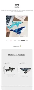 Detail showing blue acetate whale hair claw clips with product dimensions and weight
