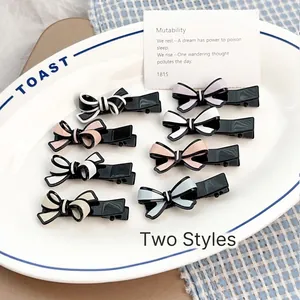 Lot de 8 jolies barrettes nœuds en acétate aux tons pastel et motifs noir et blanc
