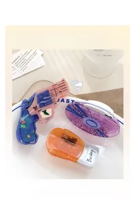 Detailed close-up of pistol, boxing, and oval shaped hair claws in acetate and glitter