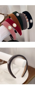 Detail of wide velvet headbands with faux pearl accents in multiple vintage colors