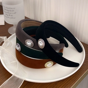 Elegant velvet headbands with vintage pearl buttons in black, grey, green, and caramel colors