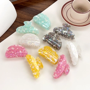Set of 10 colorful acetate shark hair claws with elegant marble patterns for women