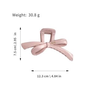 Pink bow hair claw clip in glossy finish measuring 12.3cm for women with thick hair