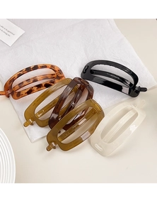 Detailed set of five large oval hollow hair clips in various glossy tortoiseshell colors