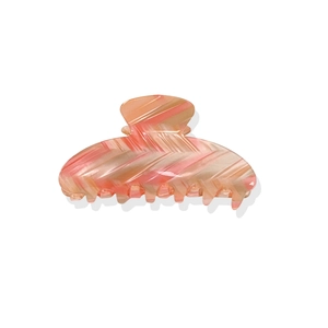 Pink and beige herringbone patterned acetate hair claw clip for women on white background
