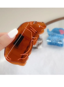 Detail of amber brown hippo hair claw clip in high-quality translucent acetate material