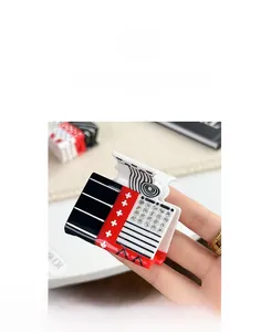 Detail of playing card theme hair claw with rhinestone accents and contrast color patterns