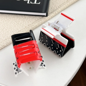 Creative poker design hair claws in red and black colors with sparkling rhinestones