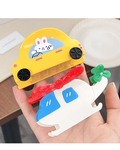 Detailed view of creative car and helicopter hair claws with cute rabbit designs