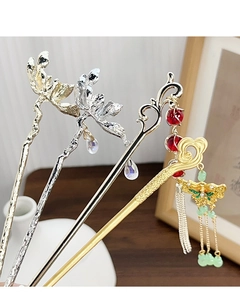 Detailed set of four Chinese style hair sticks with floral, butterfly and tassel motifs