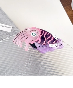 Macro detail of octopus hair claw clip made of pink and purple acetate fiber plates