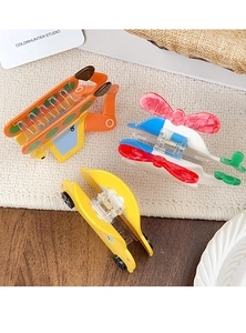 Detailed view of colorful cartoon car and helicopter hair claws on a textured surface