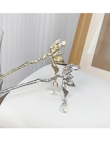 Detail of gold and silver hairpins featuring organic texture and crystal water drop charms