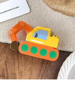 Close-up of a creative cartoon excavator hair claw clip in vibrant orange and yellow