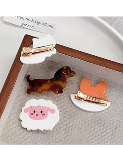 Detailed view of assorted acetate animal hair clips including cat, dog, fox and sheep