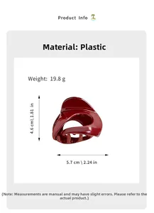 Detail view of a glossy dark red pumpkin hair claw clip showing precise size measurements