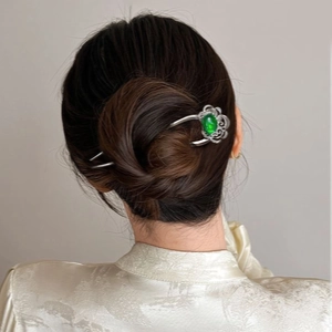 U-shaped hair pin with green gemstone and hollow flower pattern in silver metal