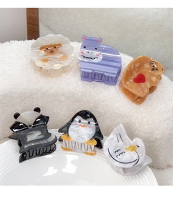 Detail shot of cute acetate animal claw clips including panda and bear designs