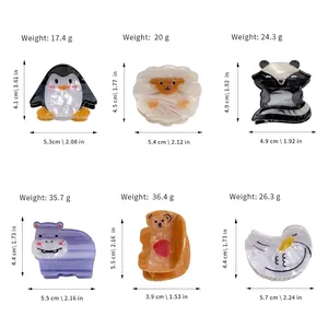 Cute acetate hair claws featuring cartoon penguin sheep raccoon hippo and bear designs