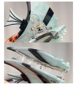Détails de la pince à cheveux en forme de poisson avec texture marbrée et ressort robuste