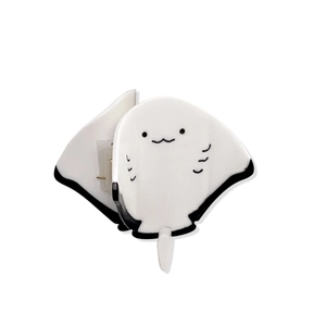 Cute whale-shaped acetate hair claw clip in black and white with a minimalist design