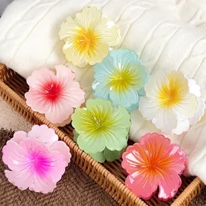 Colorful Hawaiian hibiscus flower hair claws in vibrant resin for summer beach vacation