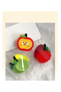 Detail view of cute red apple and yellow-green gradient acetate hair claw clips