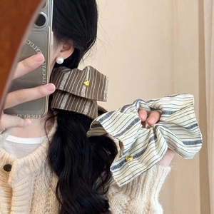 Striped bow scrunchie set in coffee and beige with a heart-shaped gold metal accent