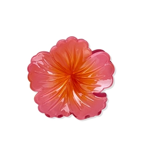 Pink and orange gradient hibiscus flower hair claw clip with a glossy finish on white background