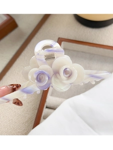 Close-up of elegant double rose hair claw clip in ivory and lilac acetate finish