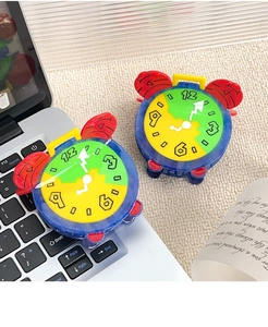 Close-up of a colorful clock-shaped acetate hair claw clip with creative dial details