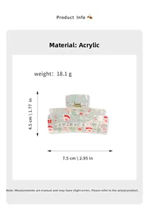 Detail view of acrylic Christmas hair claw showing Santa prints and metal spring