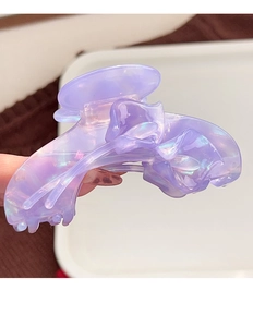 Close-up of a purple iridescent tulip acetate hair claw with aurora shimmer finish