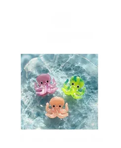 Detail of octopus shaped acetate hair clips with pearl finish and fine grip teeth