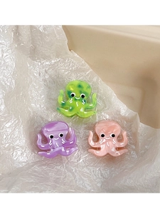 Detailed macro view of colorful octopus hair clips with acetate marble texture for kids